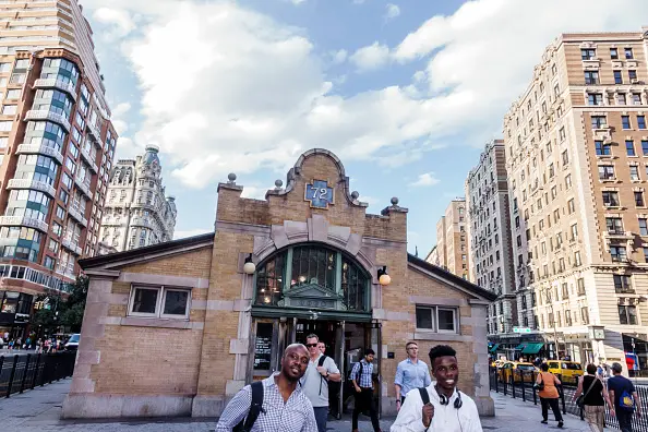 A view of the 72nd Street Upper West Side subway stop, with blue skies in the background.